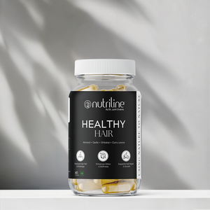 A clear jar labeled Healthy Hair contains yellow and white capsules. The label highlights benefits such as reduced fall, enhanced shine, and scalp nourishment. The jar is placed on a white surface with a light background.