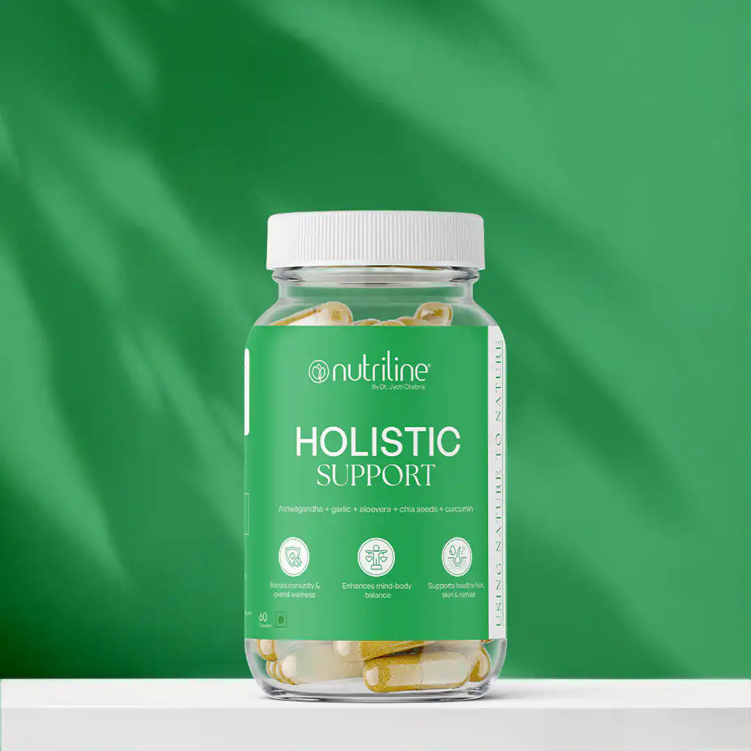 A clear jar labeled Holistic Support contains yellow and white capsules against a bright green background, with a label featuring benefits like stress relief, enhanced energy, immunity support, and Ashwagandha.