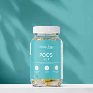 A clear bottle labeled PCOS Aid with yellow and white capsules sits against a blue background. The label highlights support for PCOS, hormone balance, PMS relief, and menstrual cycle regulation.